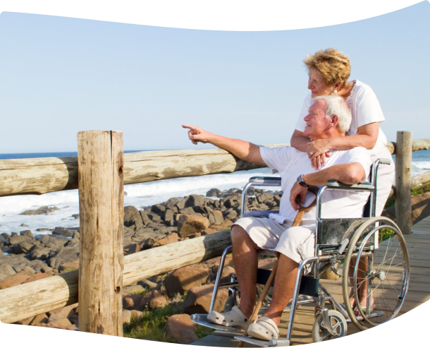 caregiver and patient sight seeing in the sea shore
